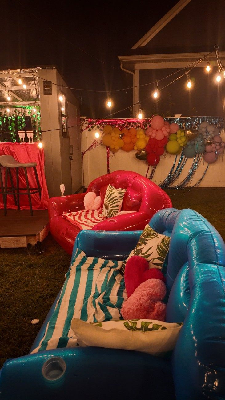 Inflatable furniture with colorful decorations on a dark outdoor setting