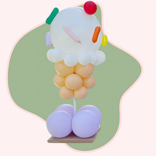 Balloon sculpture of a character with a colorful design on a light green background