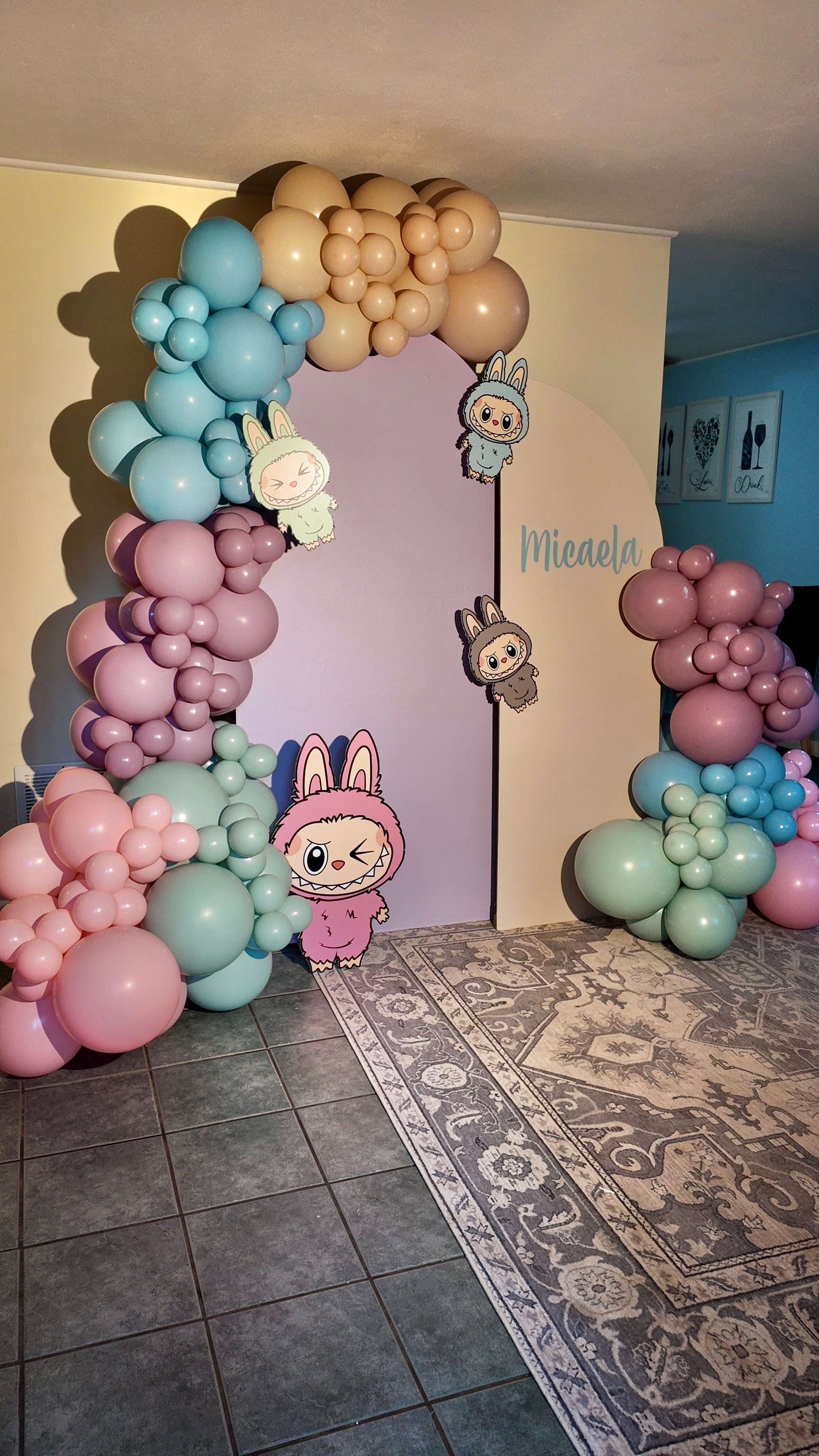 Balloon arch with pastel colors in a room setting