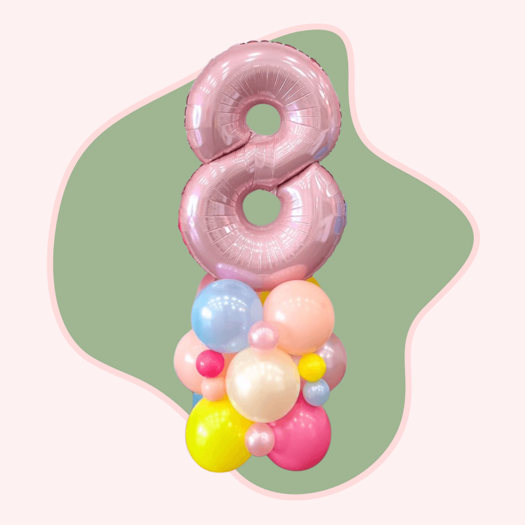 Pink number 8 balloon with colorful smaller balloons on a green and white background