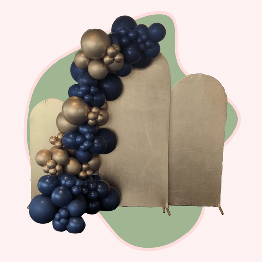 Decorative arch with blue and gold balloons against a plain background